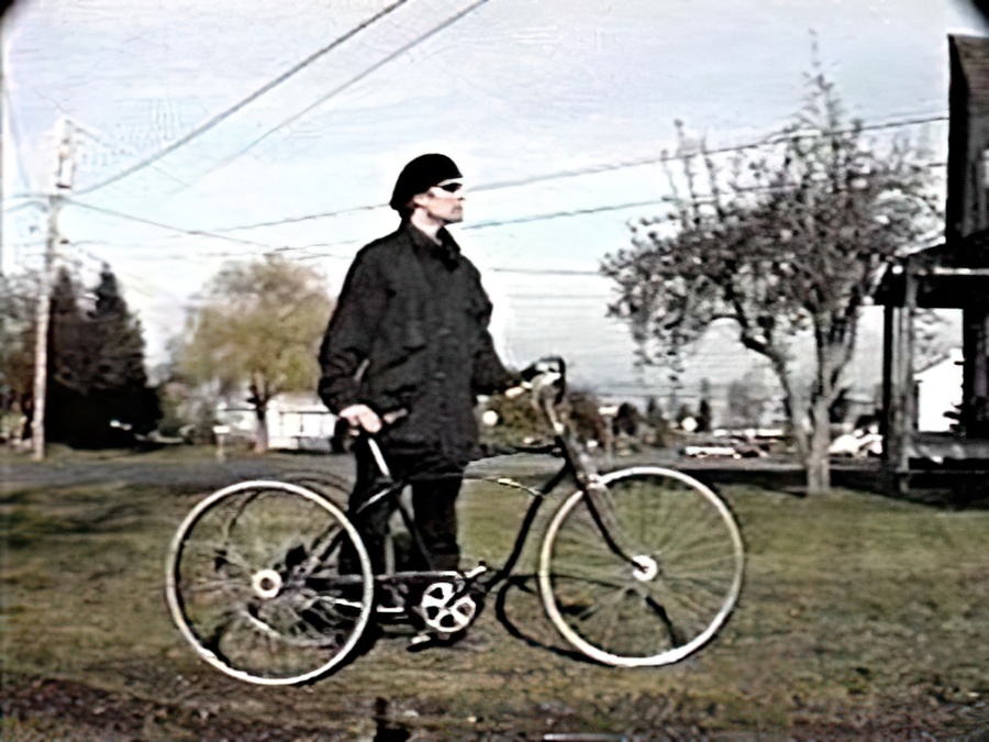 Me standing very proudly with my three-wheeler bicycle.